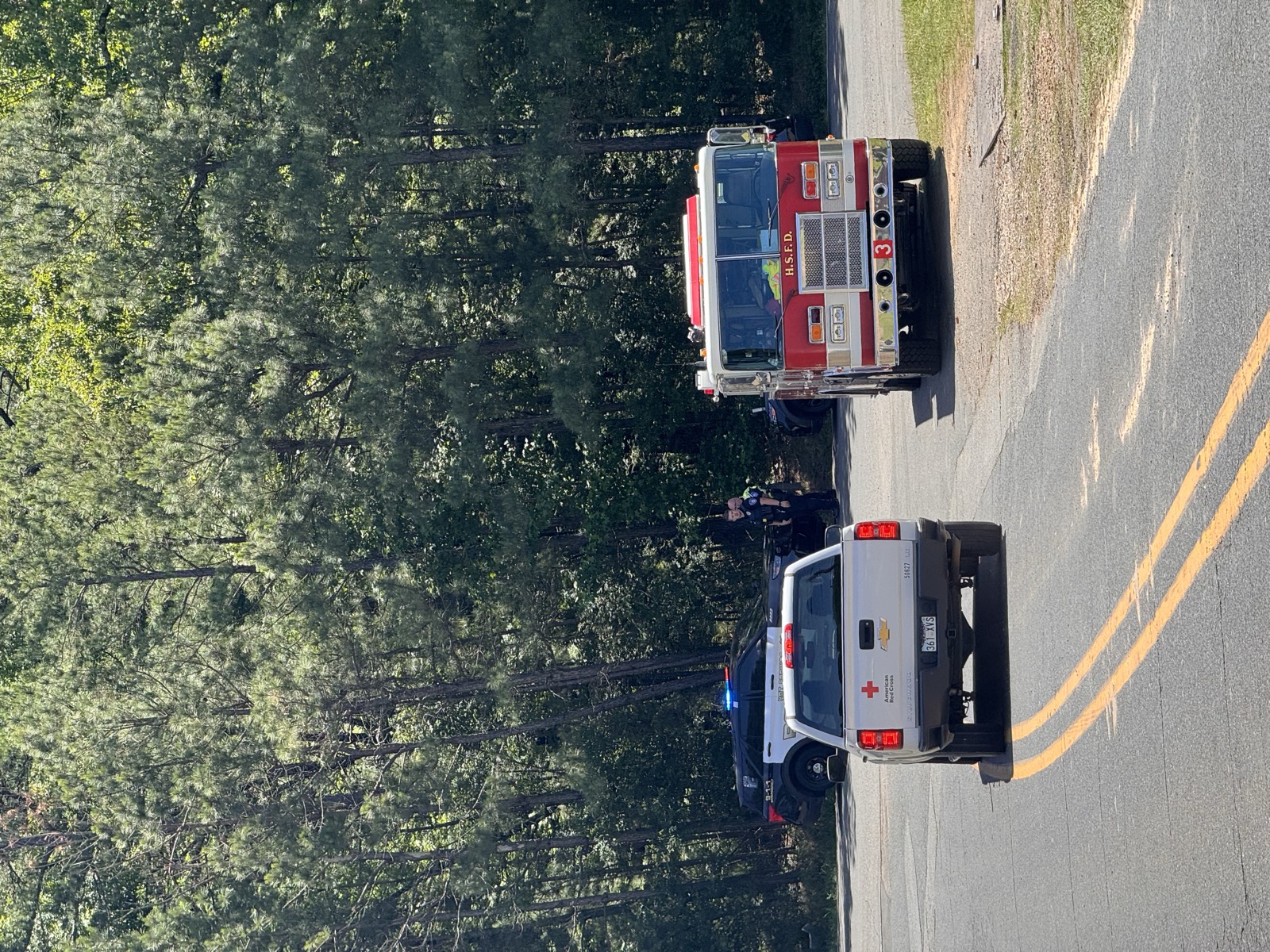 Red Cross vehicle and fire truck responding to storm damage in Arkansas