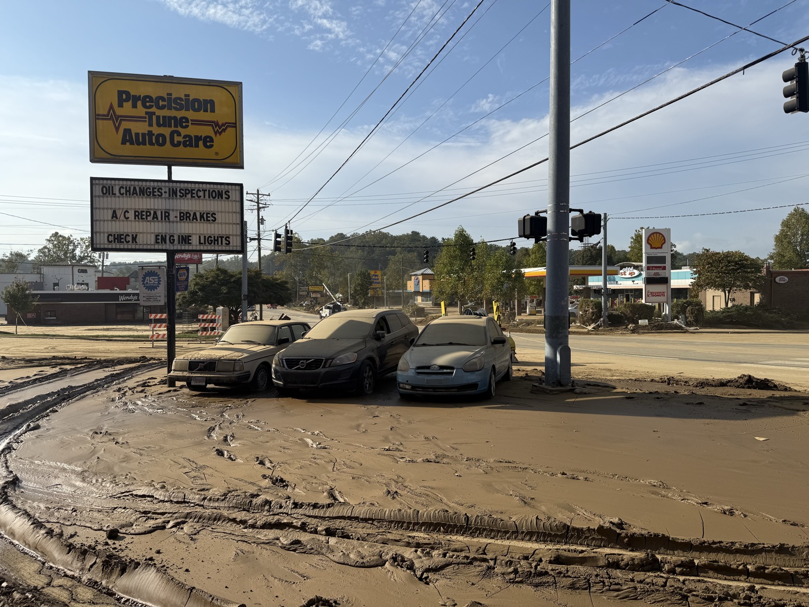 Mud and flood damage to businesses in Asheville after Hurricane Helene